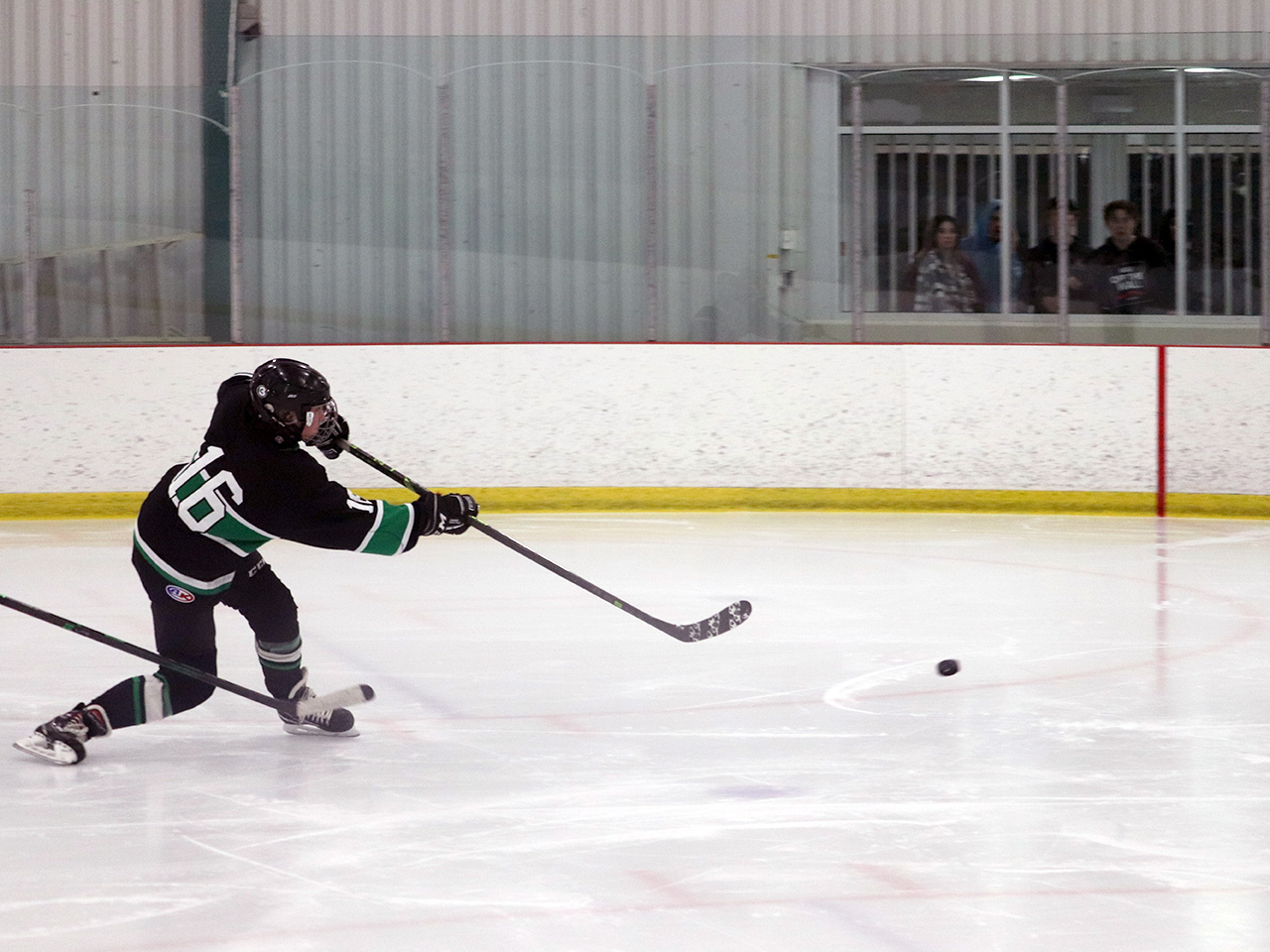 Bryson Oleksyn scores on a partial breakaway against NE702 on Feb. 3, 2023 in Sherwood Park.